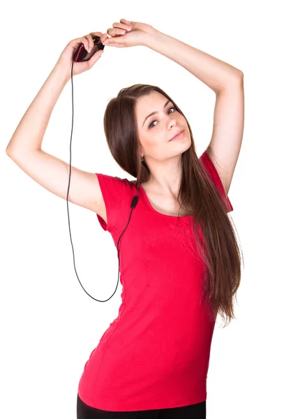 Atraktivní úsměvem teen holka poslouchat hudbu na bílém pozadí — Stock fotografie