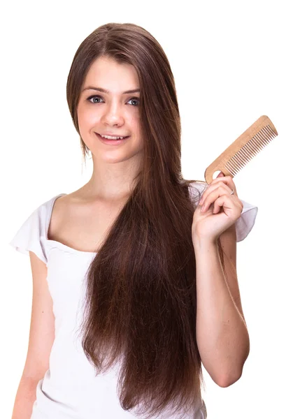 Portrait of a beautiful youth teen girl with comb isolated — Stock Photo, Image