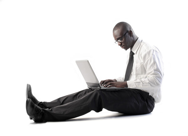 African businessman using a laptop