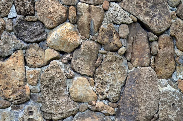 Υφή φόντου από ένα πέτρινο τοίχο — Φωτογραφία Αρχείου