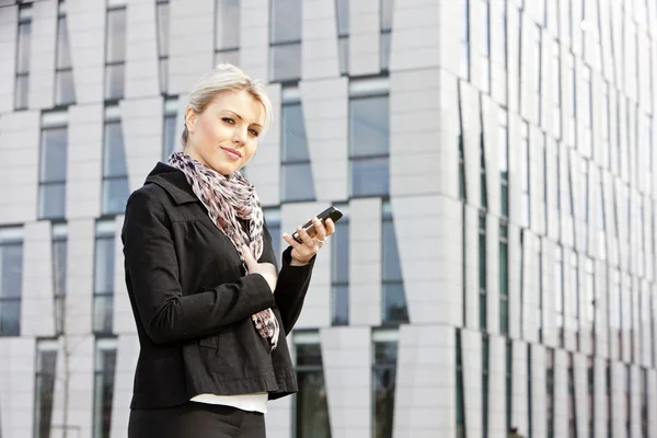 Portrait of young businesswoman with a mobile — Stock Photo, Image