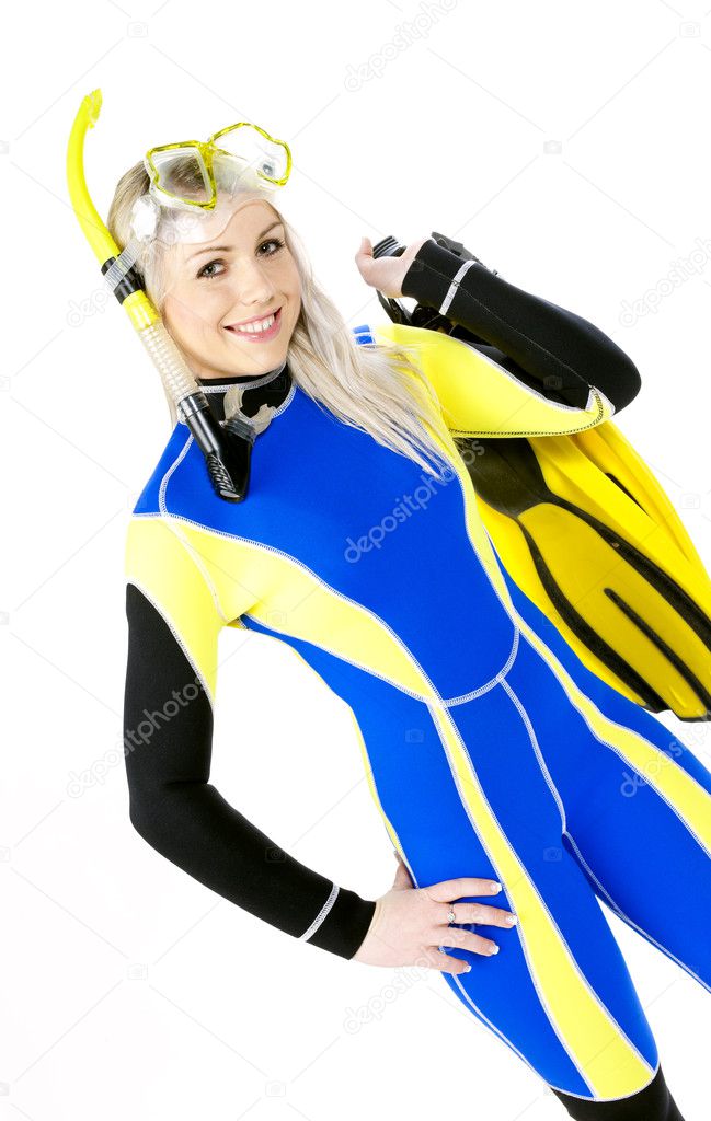 Portrait of young woman wearing neoprene with snorkeling equipme