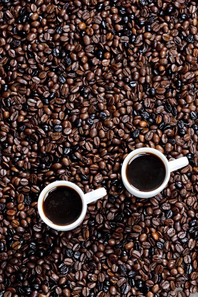 Zátiší šálků kávy a kávových zrn — Stock fotografie