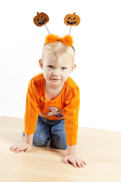 Kneeling little girl during Halloween — Stock Photo, Image