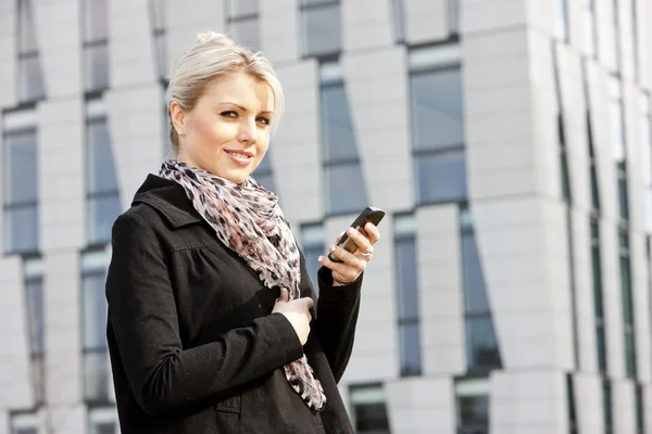 Portrait of young businesswoman with a mobile — Stock Photo, Image