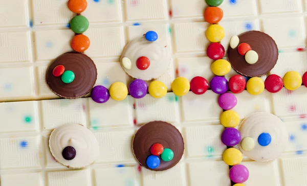 白巧克力与糖果的静物 — 图库照片