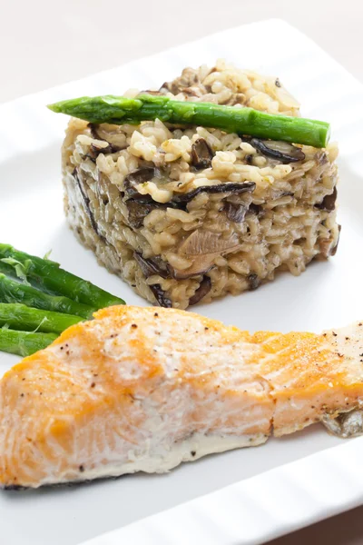 Baked salmon with mushroom risotto — Stock Photo, Image