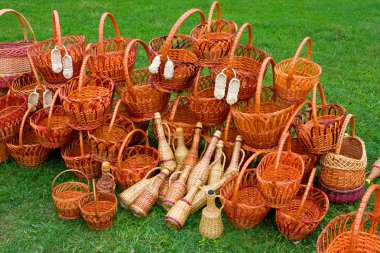 Woven baskets on green grass clipart