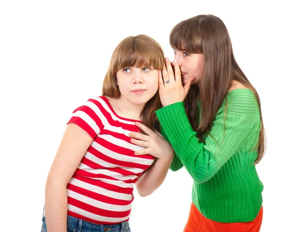 Twee schoolmeisjes fluisteren — Stockfoto