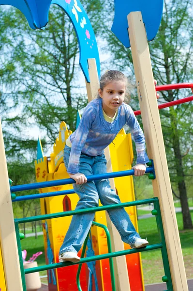 Girl having fun in playground — Stock Photo, Image