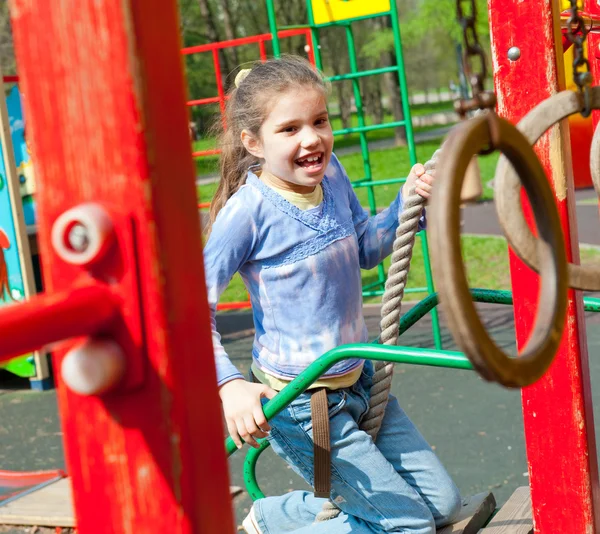 Girl having fun in playground — Stock Photo, Image