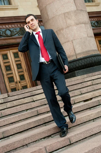 Young businessman calls on mobile — Stock Photo, Image