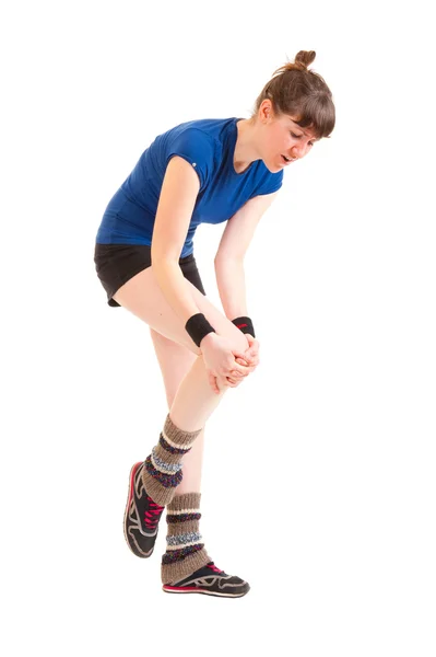 Młoda kobieta ma trafić kolana — Zdjęcie stockowe