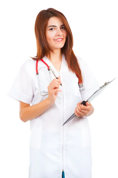 Young woman doctor writes — Stock Photo, Image