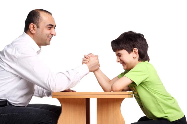 Family arm wrestling Royalty Free Stock Images