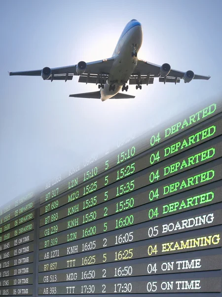 Airplane fliying over flight schedule — Stock Photo, Image