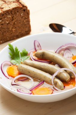 Cooked bavarian sausages in a soup clipart