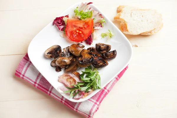 Marinated champignons and some salad in a bowl — Stock Photo, Image