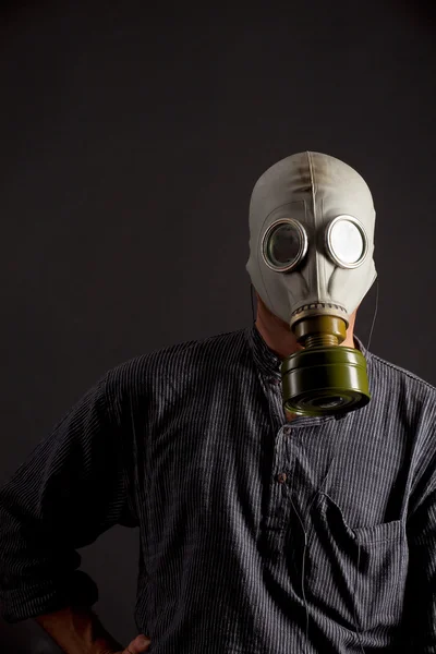 stock image Man in a gas mask on black background