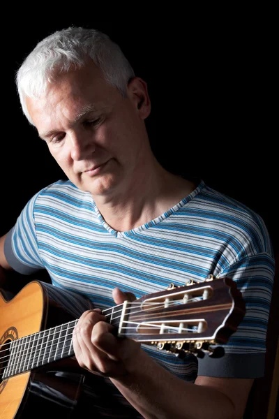 stock image Handsome man playing classical guitar