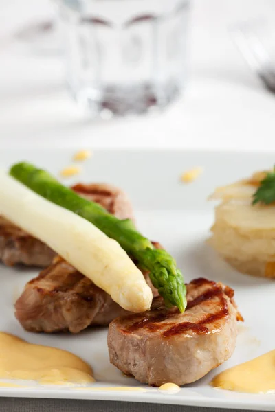 stock image Closeup of white and green asparagus on a slice of fillet
