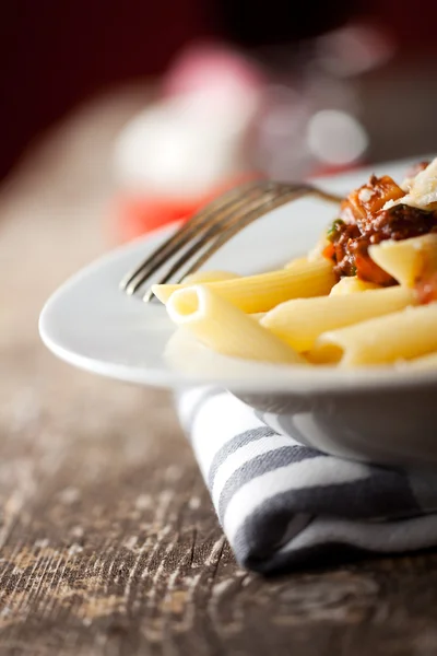 stock image Penne bolognese and parmigiano cheese