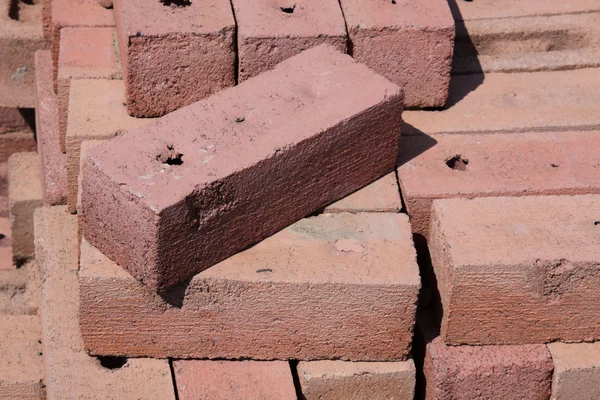 Red Brick on a Pile — Stock Photo, Image