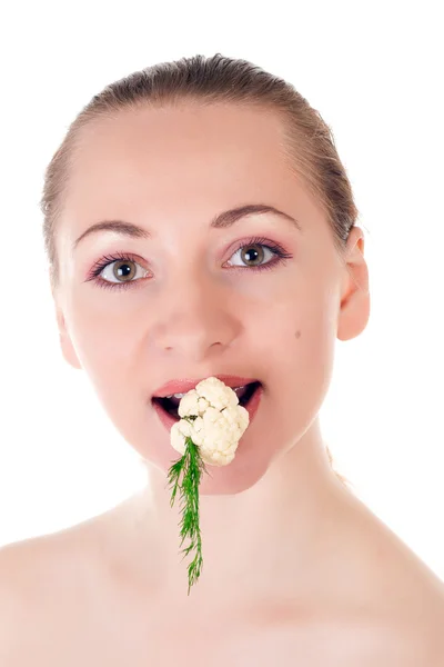 Young model with batch of dill and cauliflower in her mouth — Stock Photo, Image