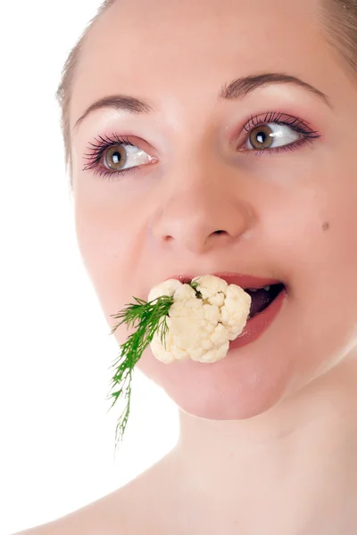 Modelo joven con lote de eneldo y coliflor en la boca — Foto de Stock