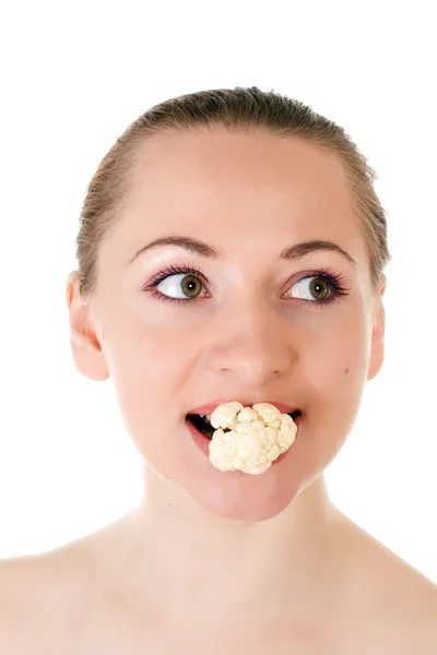 Young model with batch of cauliflower in her mouth — Stock Photo, Image