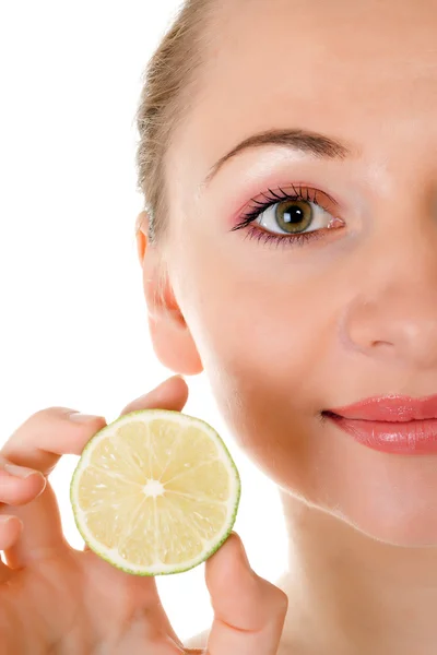 Happy pretty model posing with half of lime — Stock Photo, Image