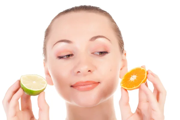 Happy pretty model posing with slice of juicy orange and half of lime — Stock Photo, Image