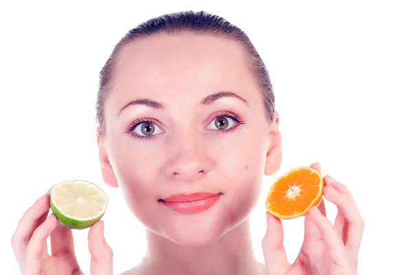 Happy pretty model posing with slice of juicy orange and half of lime — Stock Photo, Image