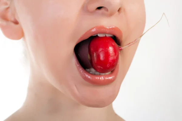 Pretty model holding radish in her mouth — Stock Photo, Image