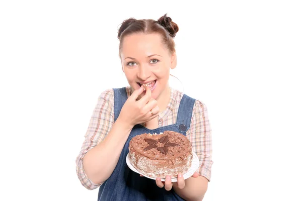 Atractiva mujer comiendo un pastel — Foto de Stock