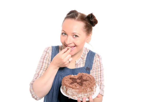 Atractiva mujer comiendo un pastel —  Fotos de Stock