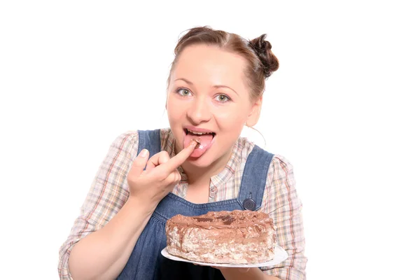 Atractiva mujer comiendo un pastel — Foto de Stock