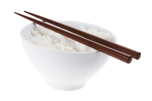 Schüssel Reis und Essstäbchen — Stockfoto
