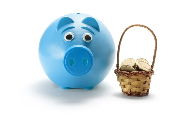 Piggy Bank and Basket of Coins — Zdjęcie stockowe
