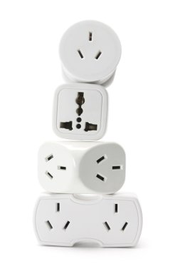 Stack of Power Adaptors clipart