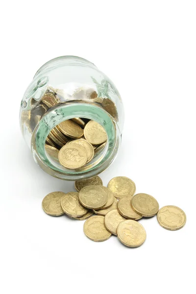 Monedas y frasco de vidrio — Foto de Stock