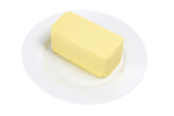 Mantequilla en la placa — Foto de Stock