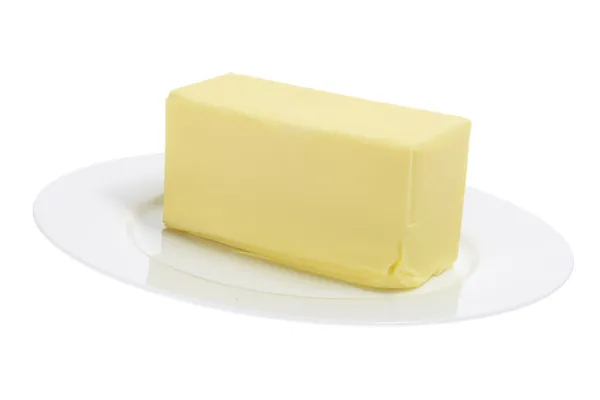 Масло на тарелке — стоковое фото