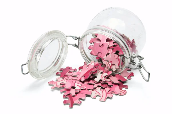 Jigsaw puzzle en glazen pot — Stockfoto
