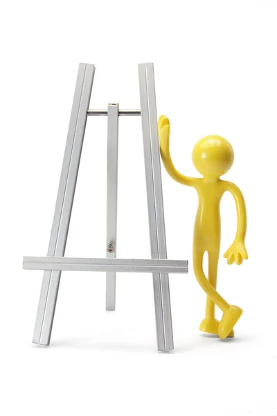 Rubber Figure and Easel — Stock Photo, Image
