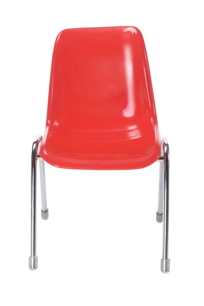 Красный пластиковый стул — стоковое фото