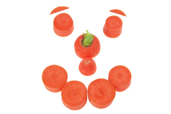 Karottenscheiben in Gesichtsform angeordnet — Stockfoto