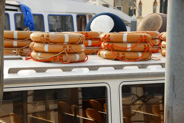 Stacks of life belts on boat — Stock Photo, Image