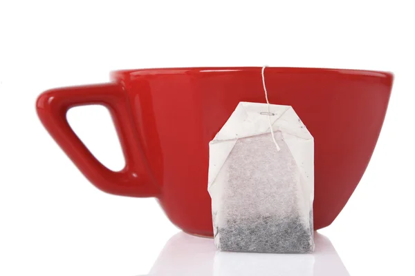 stock image Red Ceramic cup with tea bag