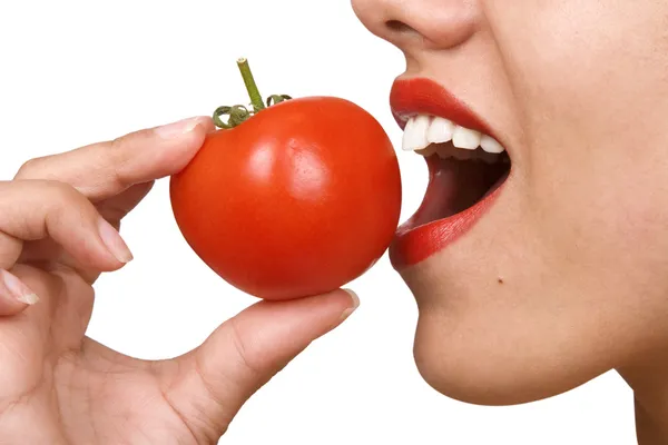 Young Woman Eating Tomatoes — Stock Photo, Image
